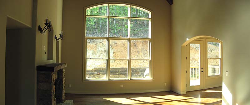 Beautiful Arched Window,
        Cedar Beams and Stone Fireplace in Living Room!