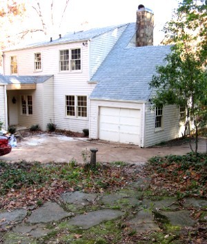 Main level garage and covered stone porch!